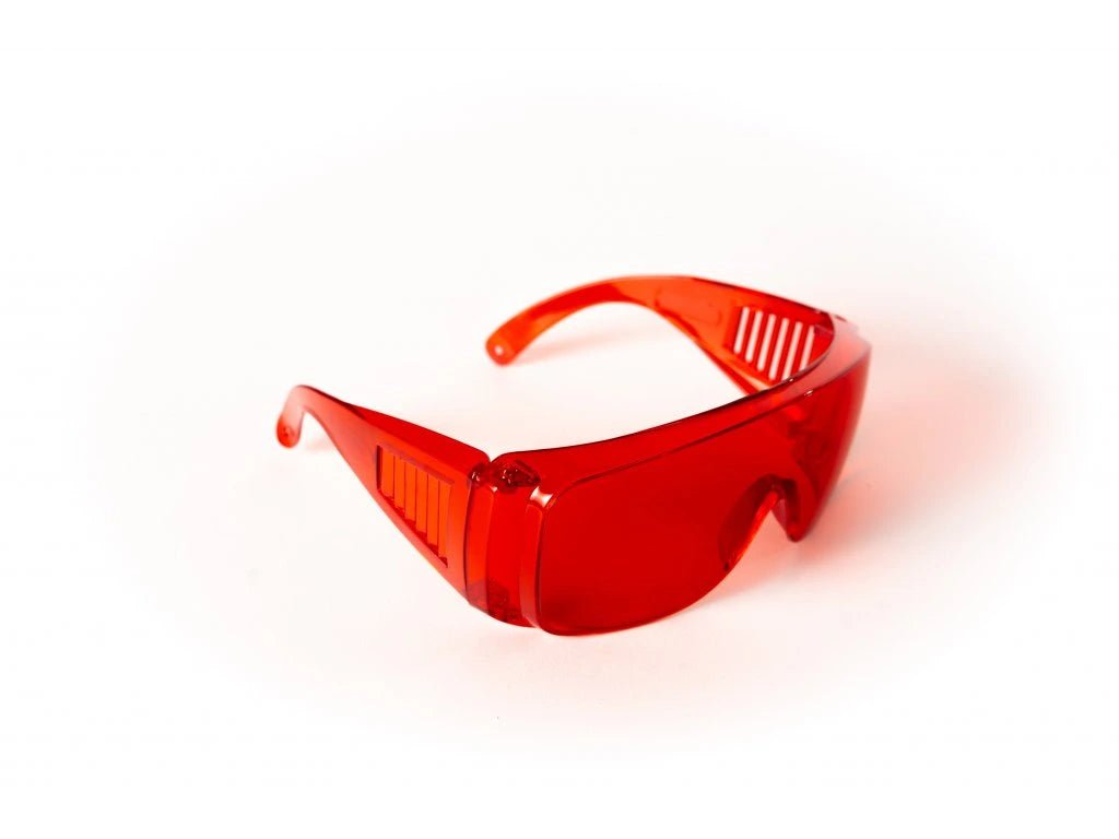 Red glasses against blue and green light - LifeUnlocked