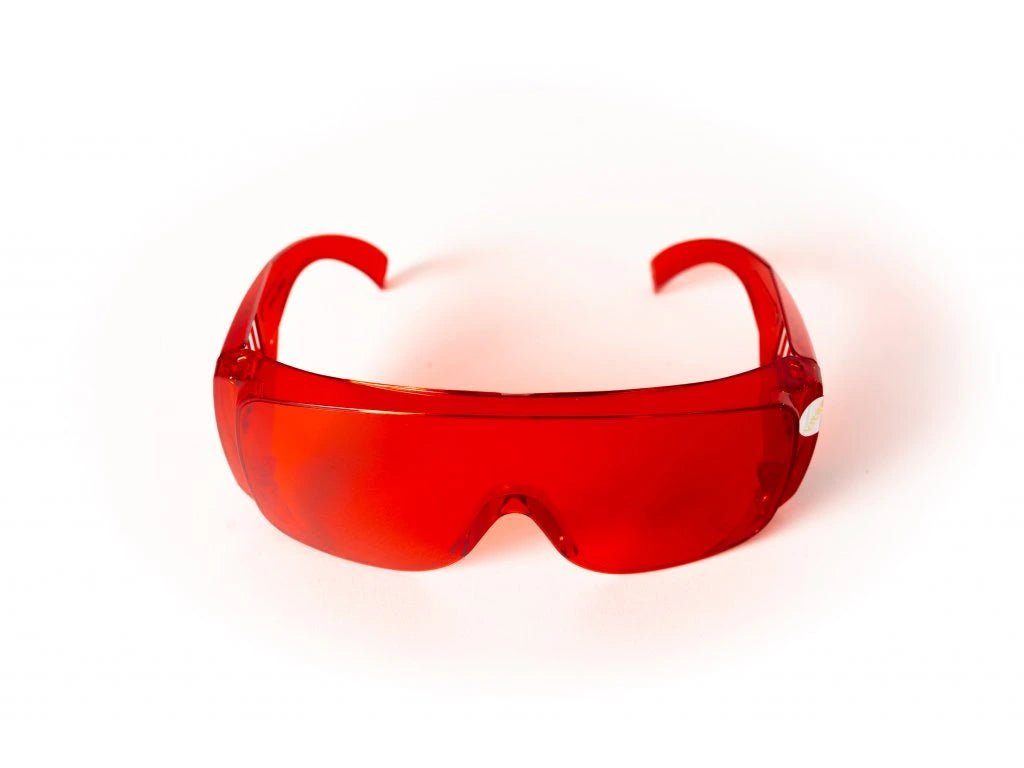 Red glasses against blue and green light - LifeUnlocked